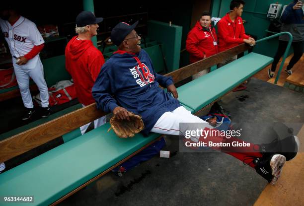 Former Boston Red Sox pitcher Dennis "Oil Can" Boyd stretches out in the dugout before the start of the Red Sox alumni game at Fenway Park in Boston...