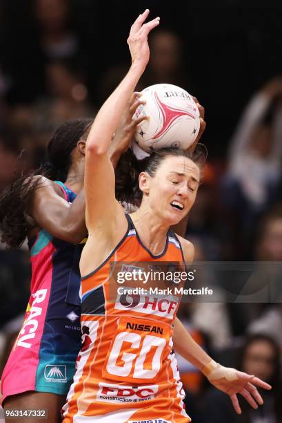 Bec Bulley of the Giants and Mwai Kumwenda of the Vixens compete for the ball during the round five Super Netball match between the Giants and the...