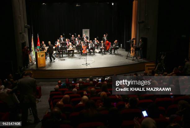 Musicians from the Beit al-Rowwad ensemble perform during a concert at Hussein Cultural Center in Amman on March 20, 2018. - Beit al-Rowwad , a group...