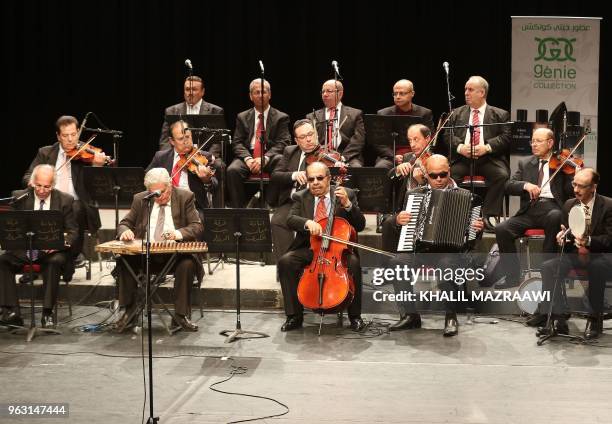 Musicians from the Beit al-Rowwad ensemble perform during a concert at Hussein Cultural Center in Amman on March 20, 2018. - Beit al-Rowwad , a group...