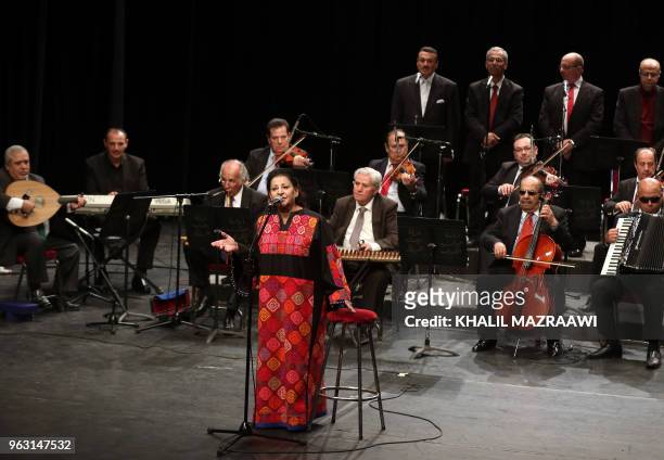 Salwa al-Aas, a 74-year-old Jordanian singer of Palestinian origin, performs during a concert with the Beit al-Rowwad ensemble at Hussein Cultural...