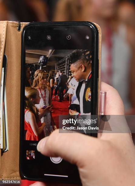 Fan takes photo of artist Tedashii at the 6th Annual KLOVE Fan Awards at The Grand Ole Opry on May 27, 2018 in Nashville, Tennessee.