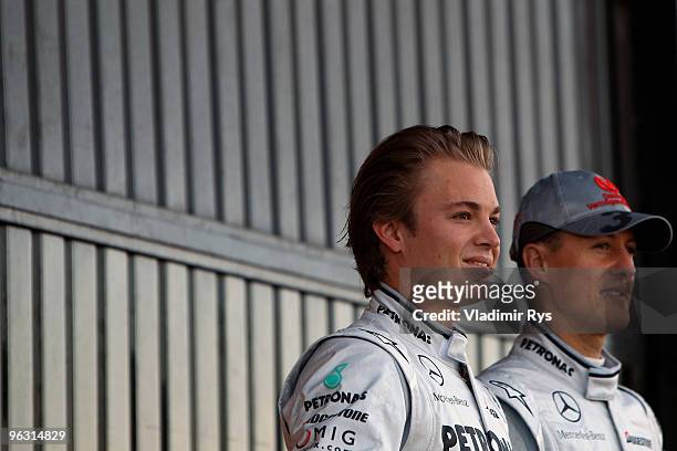 Nico Rosberg and Michael Schumacher of Germany and Mercedes are posing for a photo at their new car presentation at the Ricardo Tormo Circuit on...