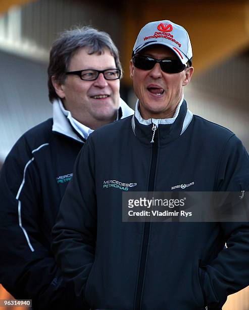 Michael Schumacher of Germany and Mercedes and Mercedes Motorsport director Norbert Haug are pictured at the Ricardo Tormo Circuit on February 1,...