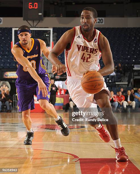 Ernest Scott of the Rio Grande Valley Vipers drives past Michael Fey of the Los Angeles D-Fenders during the NBA D-League game on January 31, 2010 at...