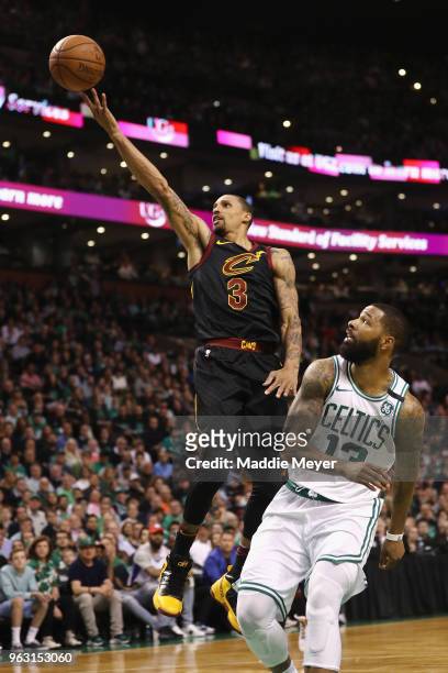 George Hill of the Cleveland Cavaliers shoots the ball against Marcus Morris of the Boston Celtics in the first half during Game Seven of the 2018...
