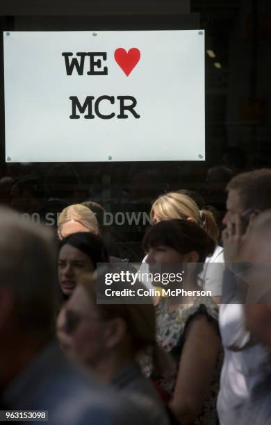 People in St. Ann's Square, Manchester taking part in a minute's silence as locations around the United Kingdom observed a minute's silence in memory...