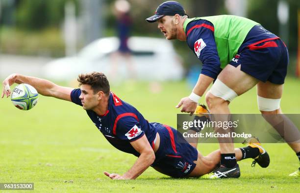 Tom English of the Rebels dives for the ball during a Melbourne Rebels Super Rugby training session at Gosch's Paddock on May 28, 2018 in Melbourne,...