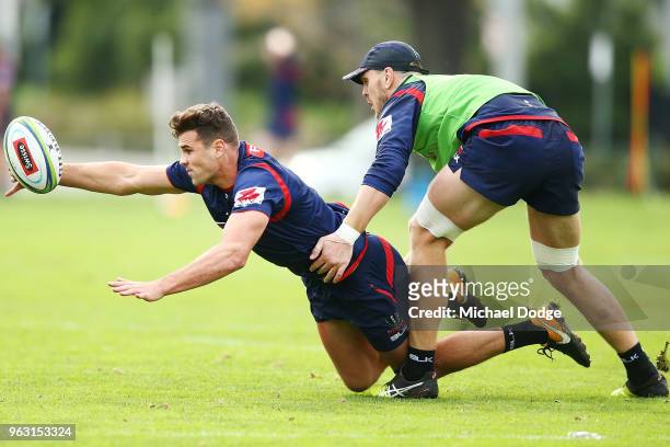 Tom English of the Rebels dives for the ball during a Melbourne Rebels Super Rugby training session at Gosch's Paddock on May 28, 2018 in Melbourne,...