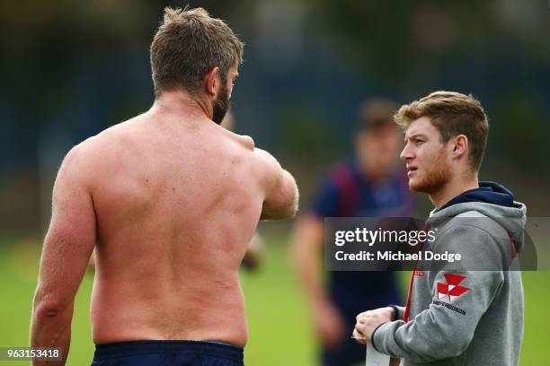 International recruit Geoff Parling of the Rebels looks down on his troublesome shoulder as he waits to have it restrapped during a Melbourne Rebels...
