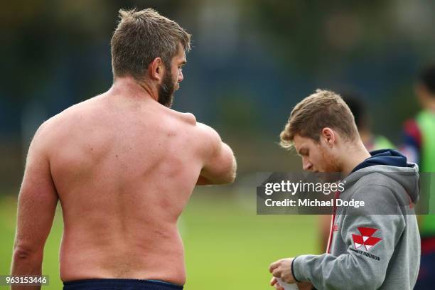 International recruit Geoff Parling of the Rebels looks down on his troublesome shoulder as he waits to have it restrapped during a Melbourne Rebels...