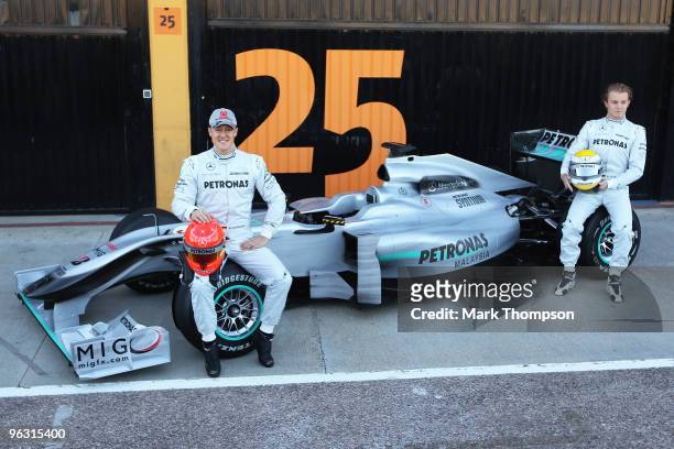 Michael Schumacher of Germany and Mercedes GP and Nico Rosberg of Germany and Mercedes GP attend the roll out of the new Mercedes W01 at the Ricardo...