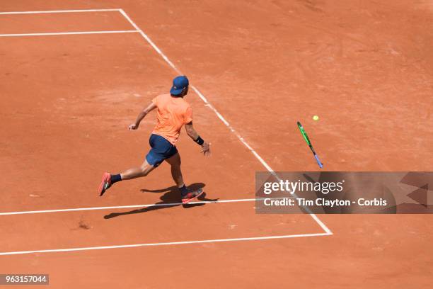 French Open Tennis Tournament - Lucas Pouille of France throws his racquet at the ball after it has passed him much to the delight of the crowd while...