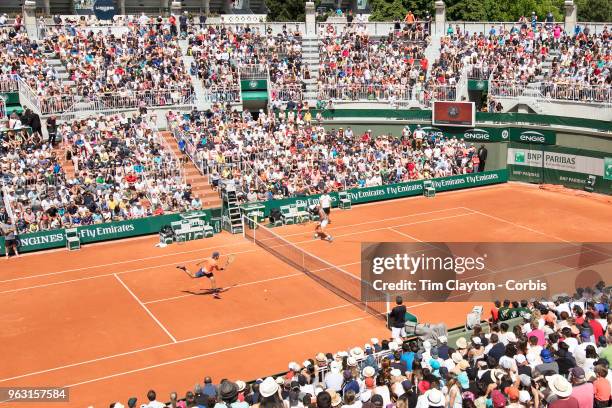 French Open Tennis Tournament - Rafael Nadal of Spain and Lucas Pouille of France training on Court One on a packed Children's Day at Roland Garros...