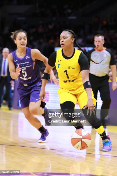 Odyssey Sims of the Los Angeles Sparks handles the ball against Leilani Mitchell of the Phoenix Mercury during a WNBA basketball game at Staples...