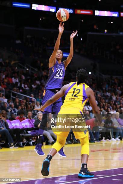 DeWanna Bonner of the Phoenix Mercury handles the ball against Chelsea Gray of the Los Angeles Sparks during a WNBA basketball game at Staples Center...