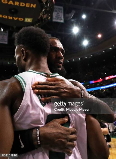 LeBron James of the Cleveland Cavaliers hugs Jaylen Brown of the Boston Celtics after during Game Seven of the 2018 NBA Eastern Conference Finals at...
