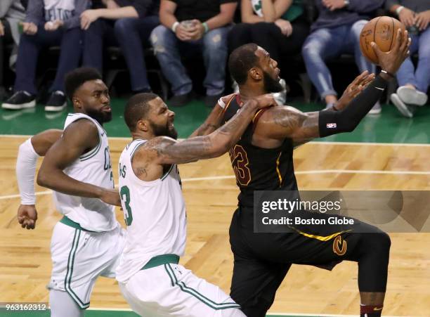 Boston Celtics Marcus Morris fouls Cleveland Cavaliers LeBron James during the fourth quarter. The Boston Celtics hosted the Cleveland Cavaliers for...