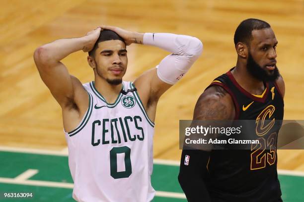 Jayson Tatum of the Boston Celtics reacts as he stands next to LeBron James of the Cleveland Cavaliers in the second half during Game Seven of the...