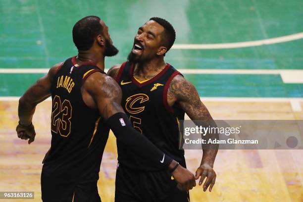 LeBron James of the Cleveland Cavaliers celebrates with JR Smith in the second half against the Boston Celtics during Game Seven of the 2018 NBA...