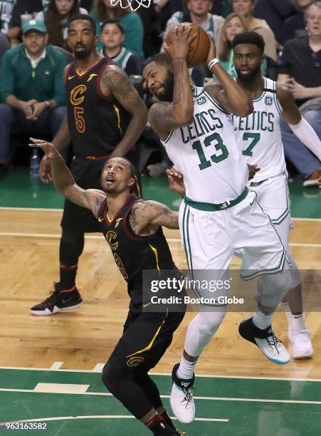Boston Celtics Marcus Morris pulls down an offensive rebound over Cleveland Cavaliers George Hill during second quarter action. The Boston Celtics...
