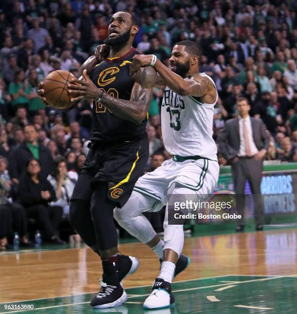 Boston Celtics' Marcus Morris makes sure that the Cavaliers LeBron James can't score on a late fourth quarter breakaway. The Boston Celtics hosted...