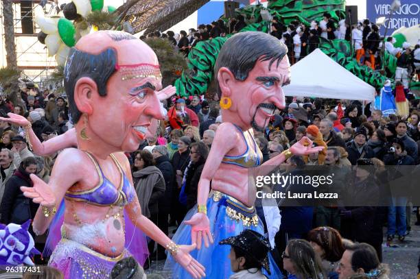 Papier-maché floats representing Italian politicians Minister Angelino Alfano and Minister Ignazio La Russa parade through the streets of Viareggio...