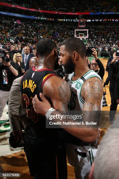 LeBron James of the Cleveland Cavaliers and Marcus Morris of the Boston Celtics hug after the game during Game Seven of the Eastern Conference Finals...