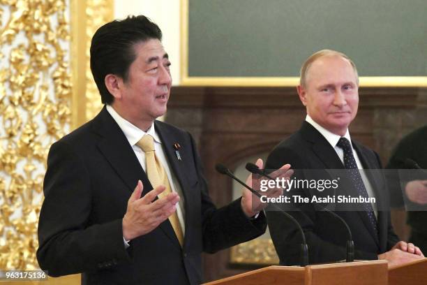 Japanese Prime Minister Shinzo Abe and Russian President Vladimir Putin attend a joint press conference following their meeting at Kremlin on May 26,...