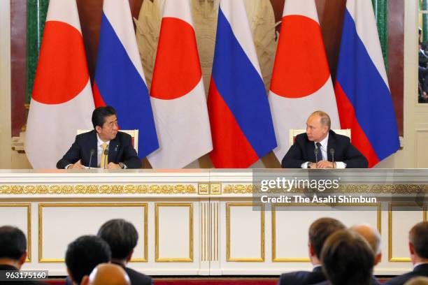 Japanese Prime Minister Shinzo Abe and Russian President Vladimir Putin attend a joint press conference following their meeting at Kremlin on May 26,...