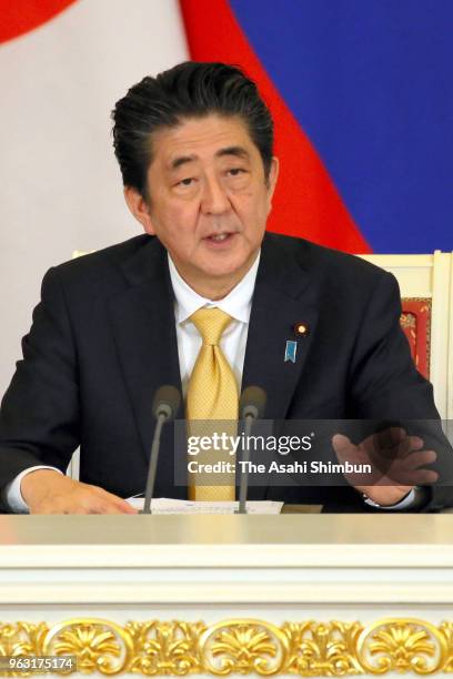 Japanese Prime Minister Shinzo Abe speaks during a joint press conference with Russian President Vladimir Putin following their meeting at Kremlin on...