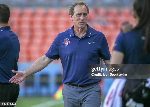 Washington Spirit head coach James Gabarra talks with staff on the sidelines during the soccer match between the Washington Spirit and Houston Dash...