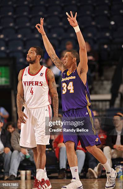 Diamon Simpson of the Los Angeles D-Fenders celebrates a basket and a foul as Antonio Anderson of the Rio Grande Valley Vipers looks on during the...