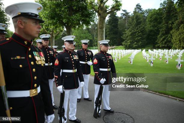 Marines stand near the graves of U.S. Soldiers, most of them killed in the World War I Battle of Belleau Wood, before a ceremony to commemorate the...