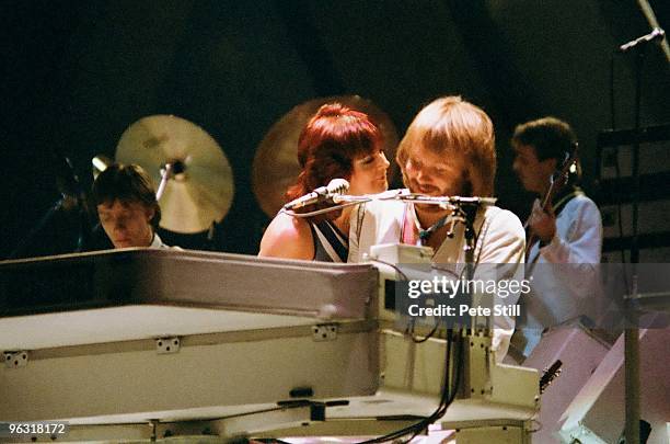 Anni-Frid Lyngstad and Benny Andersson of ABBA perform on stage at Wembley Arena on November 8th, 1979 in London, United Kingdom.