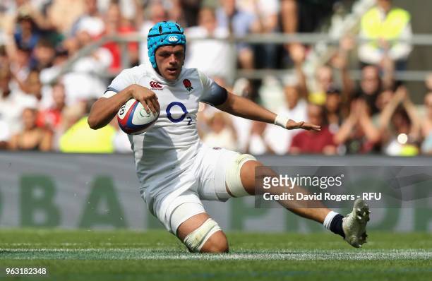 Zach Mercer of England scores a try during the Quilter Cup match between England and the Barbarians at Twickenham Stadium on May 27, 2018 in London,...