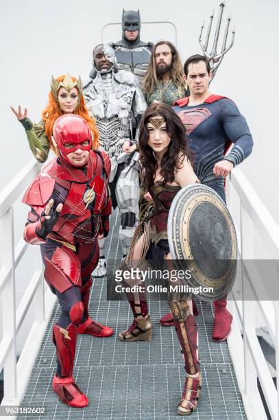 Cosplay group seen in character as Batman, Aquaman, Mera, Wonder Woman, The Flash and Cyborg from The Justice League on Day 3 of of the MCM London...