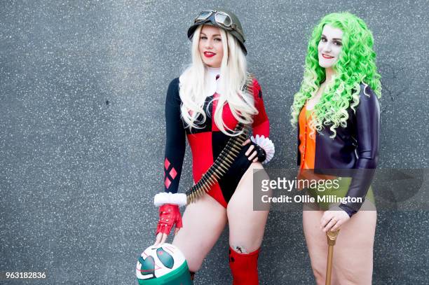 Cosplayers seen in character as Bombshell Harley Quinn and a Latex fem Joker on the 3rd day of the MCM London Comic Con 2018 at ExCel on May 27, 2018...