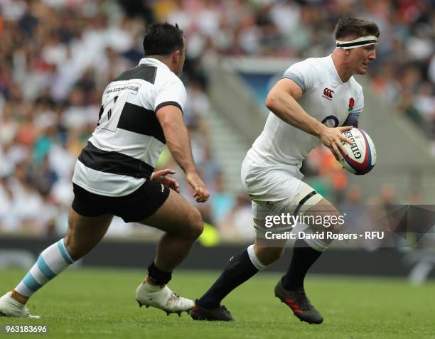 Tom Curry of England breaks with the ball during the Quilter Cup match between England and the Barbarians at Twickenham Stadium on May 27, 2018 in...