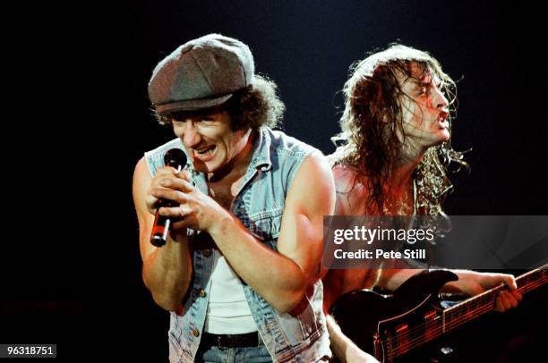 Brian Johnson and Angus Young of AC/DC perform on stage at Wembley Arena on January 17th, 1986 in London, United Kingdom.