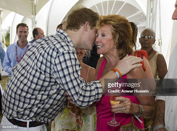 Prince Harry kisses Cilla Black at a reception before the inaugural Sentebale Polo Cup on January 31, 2010 in Apes Hill, Barbados. The Sentebale Polo...