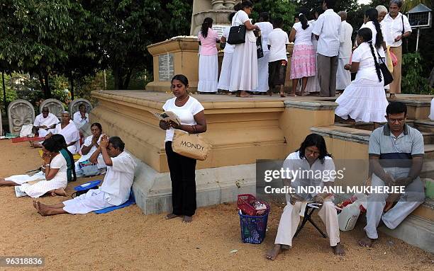 Sri Lankan Buddhist devotees offers prayers on Poya-full moon at the Kelaniya Temple in Kelaniya, Gampaha district on January 29, 2010. The...