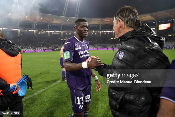 Ibrahim Sangare of Toulouse celebrates with Head coach Michael Debeve during the Ligue 1 play-off match between Toulouse and AC Ajaccio on May 27,...