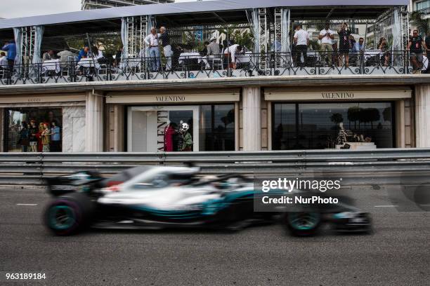 Lewis Hamilton from Great Britain Mercedes W09 Hybrid EQ Power+ team Mercedes GP in front of Valentino shops during the Race of Monaco Formula One...