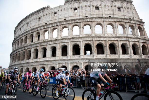 The pack of cyclists pedals past the ancient Colosseum during the last stage of the Giro d'Italia cycling race, in Rome, Sunday, May 27, 2018....