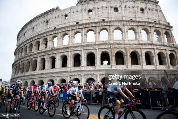 The pack of cyclists pedals past the ancient Colosseum during the last stage of the Giro d'Italia cycling race, in Rome, Sunday, May 27, 2018....