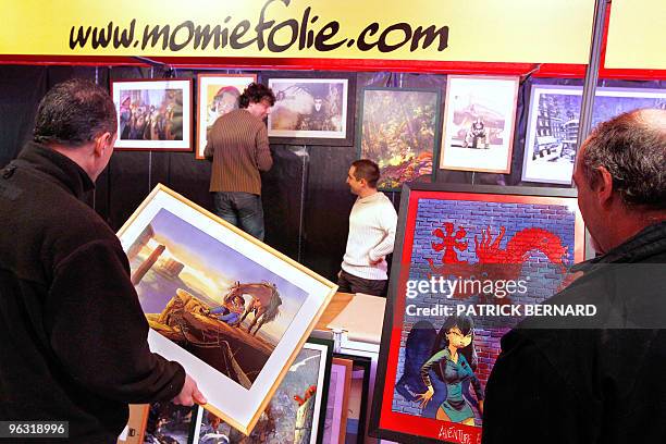 People set up their stand on January 27, 2010 in Angouleme, western France, on the eve of the opening of the 37th edition of the International comic...