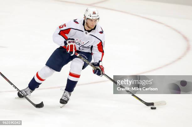 Andre Burakovsky of the Washington Capitals looks to move the puck against the Tampa Bay Lightning in Game Seven of the Eastern Conference Finals...