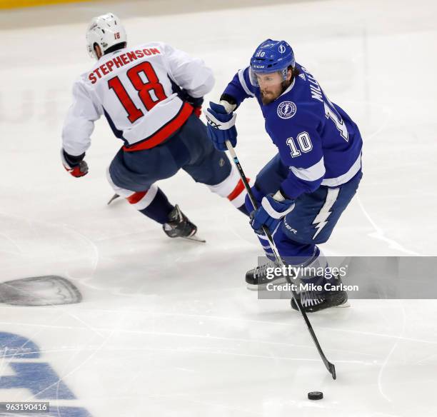 Miller of the Tampa Bay Lightning avoids the check of Chandler Stephenson of the Washington Capitals in Game Seven of the Eastern Conference Finals...