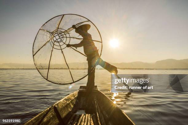 balancing act - intha fisherman stock pictures, royalty-free photos & images